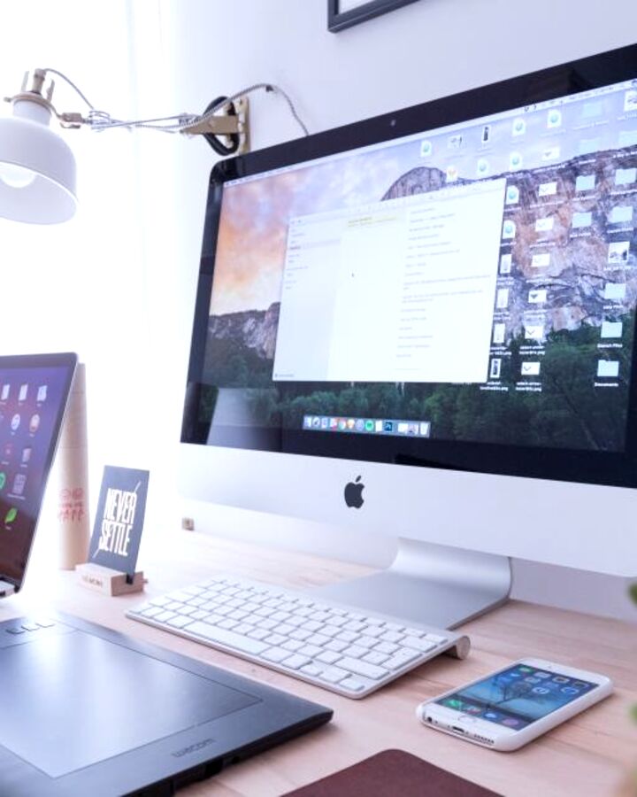 A workspace with a monitor and laptop